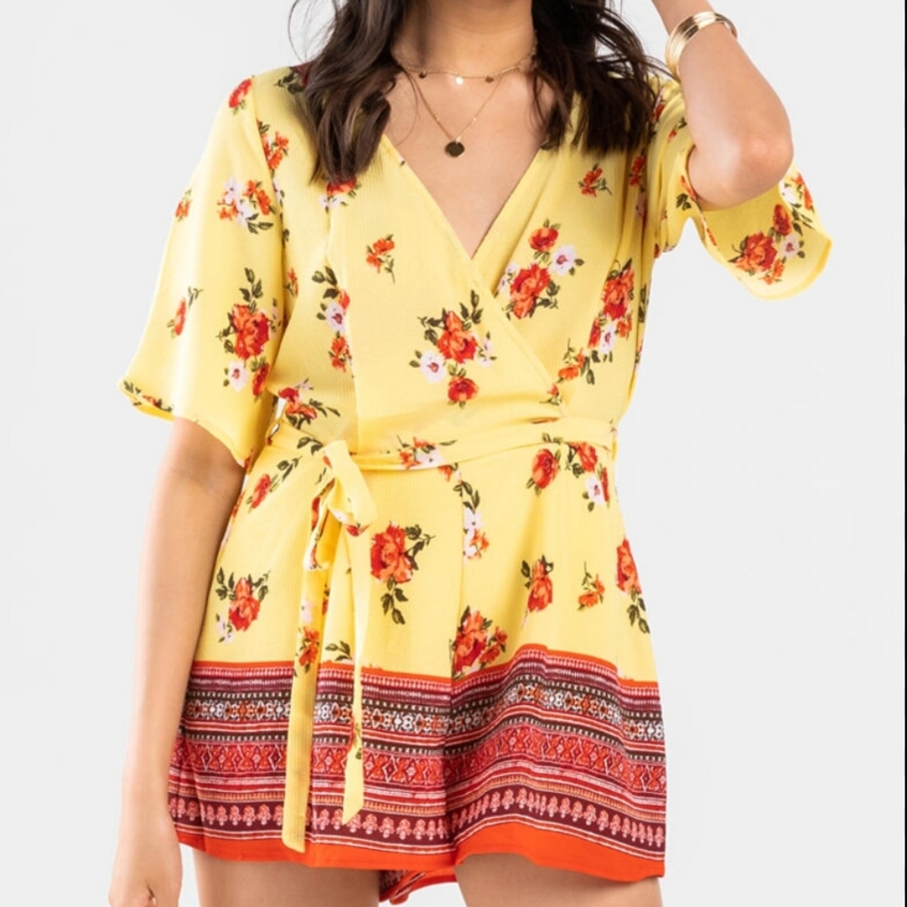 Yellow floral romper size large from mi ami. Has your at waist